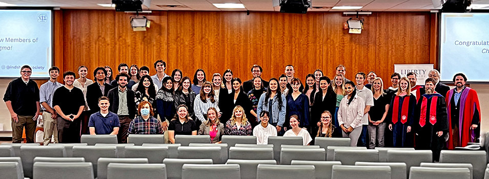 Group of students and faculty photographed at the first induction ceremony.