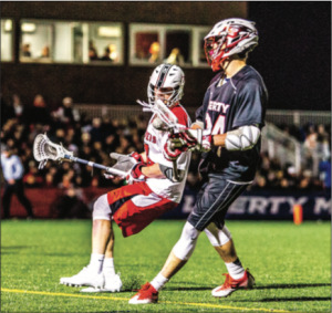 UNDEFEATED — The Flames lacrosse team improved to 5-0 in midnight games. Photo Credit: Caroline Sellers