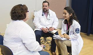 LUCOM student-doctors greet a patient during November's medical outreach in Martinsville, Va.