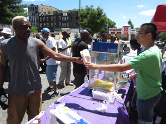 Volunteers hand out popcorn at Crossover.