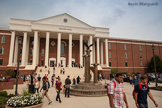 Liberty University students pass in and out of DeMoss Hall.
