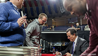 Rick Santorum signs books for Liberty students after his message.